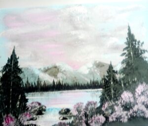 Pink sky over lake with pink flowers