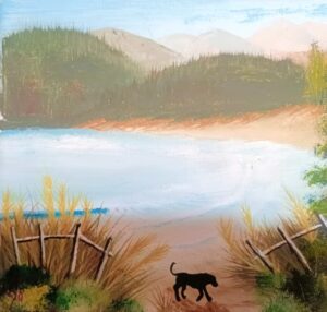 Dog and fence at a lake